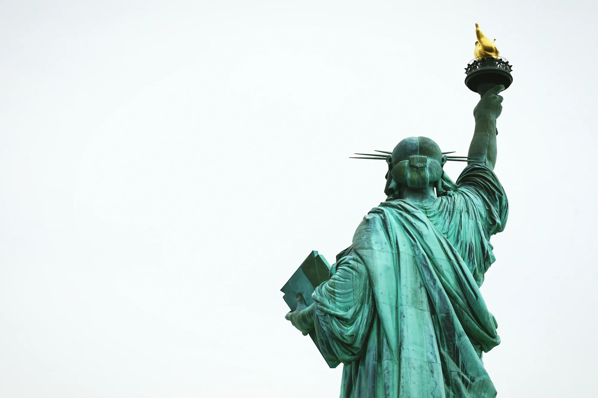 Statue of Liberty in New York City, photographed by Maarten van den Heuvel; the city is a central setting in The Catcher in the Rye